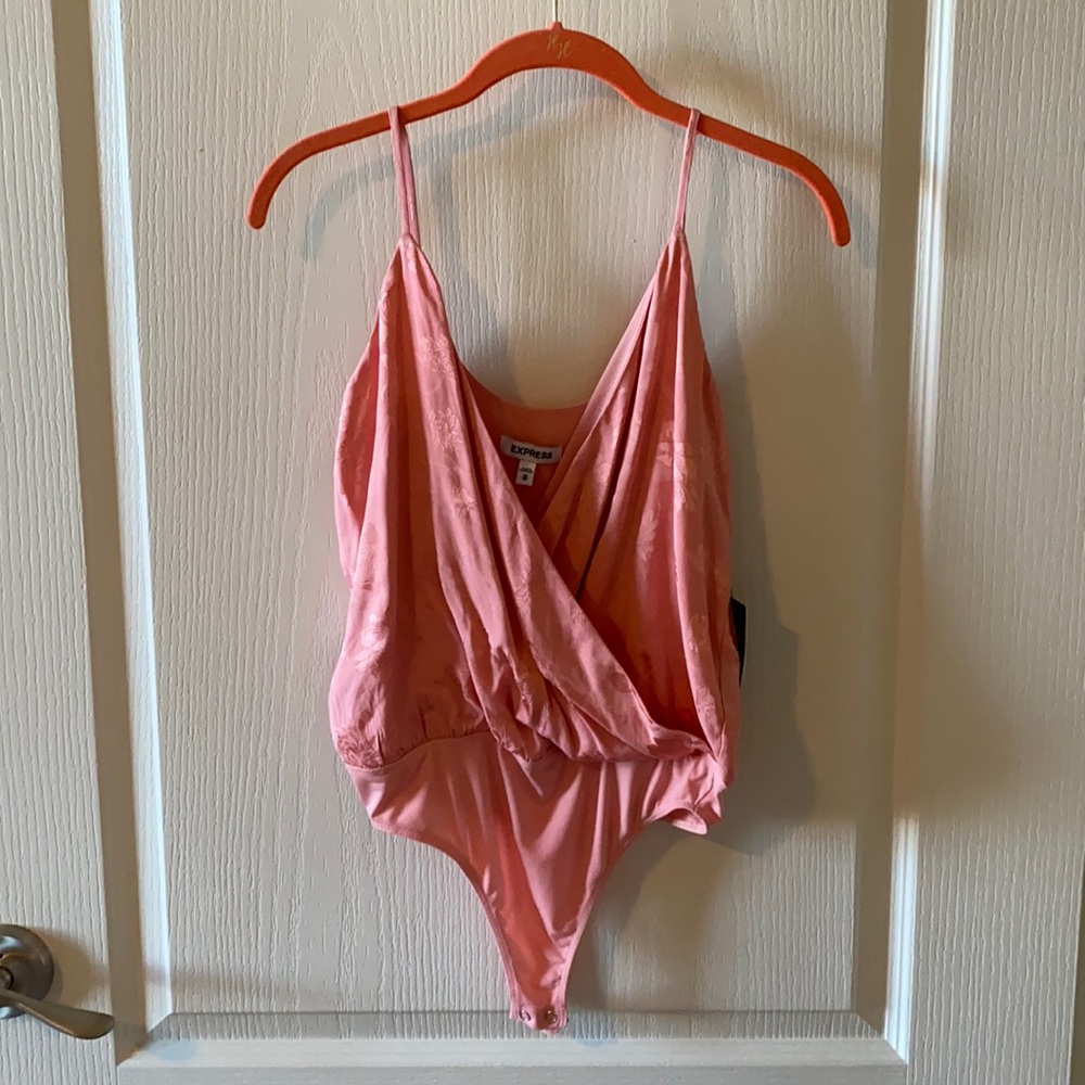 New with tags express pink tank body suit.